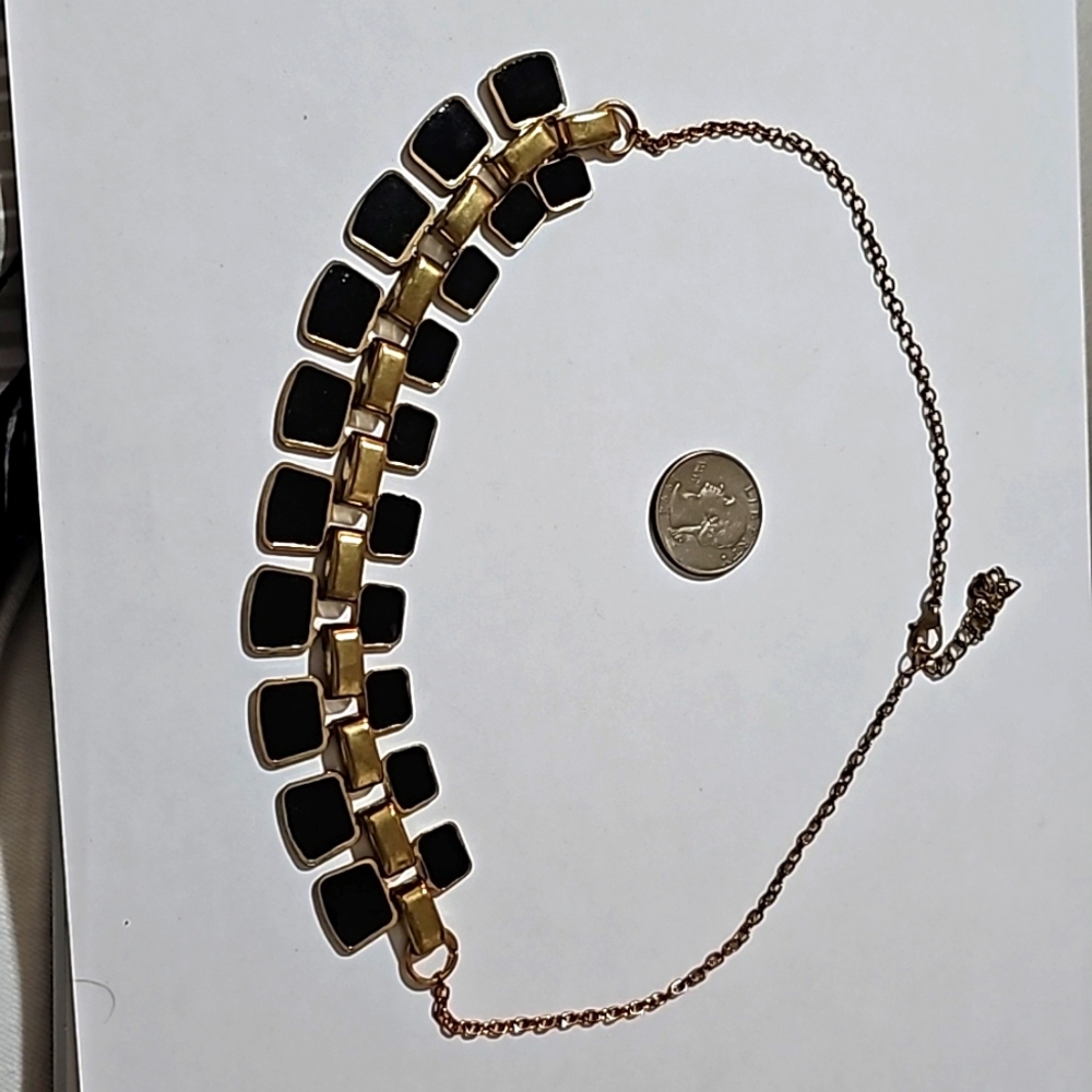 Gold tone and black rectangle necklace on chain